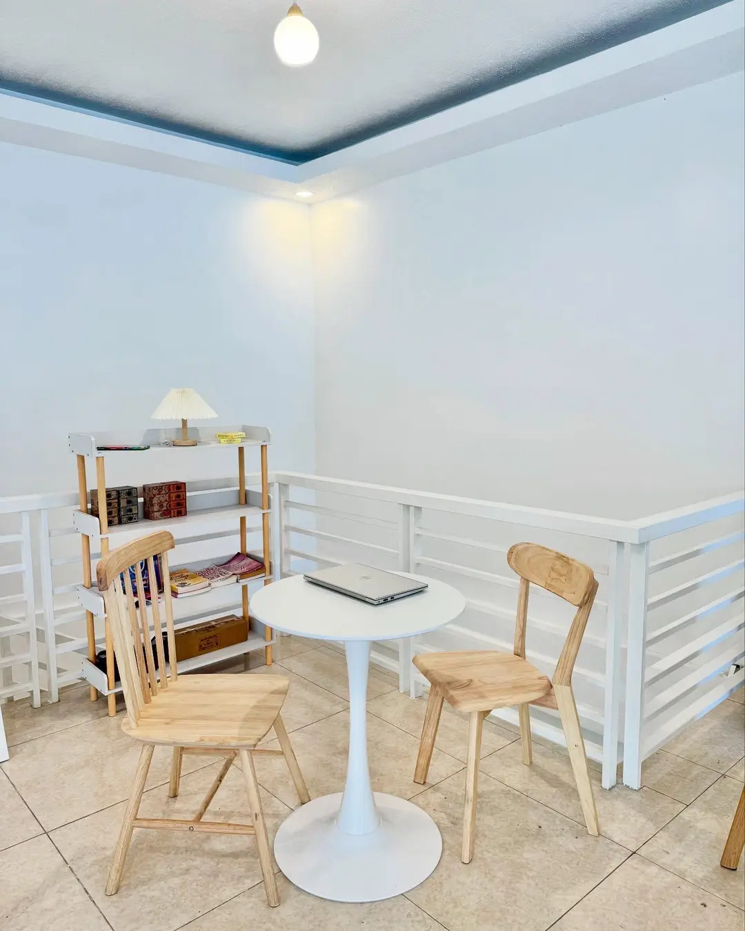 Reading corner with a bookshelf and small white table
