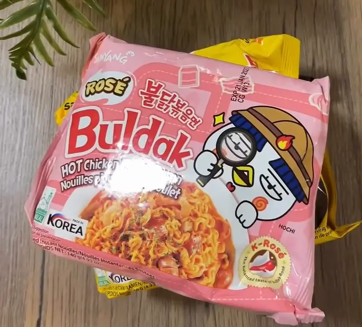 A Buldak Rosé packet held up inside the Ramyeon Bar