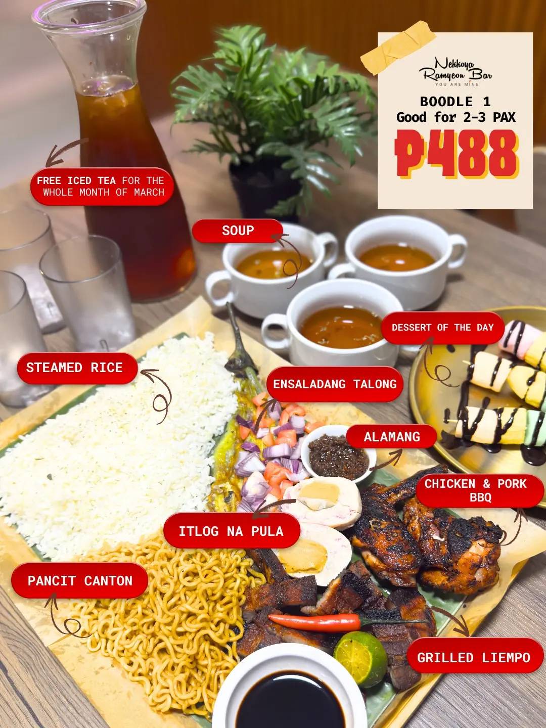 Boodle spread on banana leaves with rice, grilled liempo and BBQ